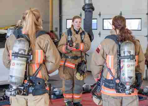 A firefighter giving instructions to her team